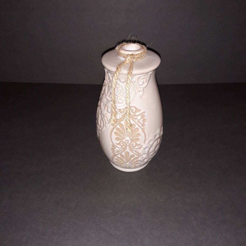 ceramic art vase, both embossed and engraved taupe colored accent piece.